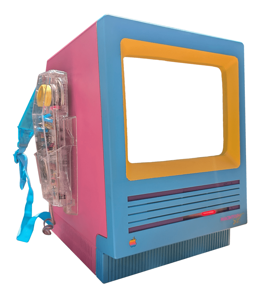 MacPack image, showing original Macintosh SE case painted light blue, yellow, pink, and purple; with backpack straps and an old clear telephone attached.